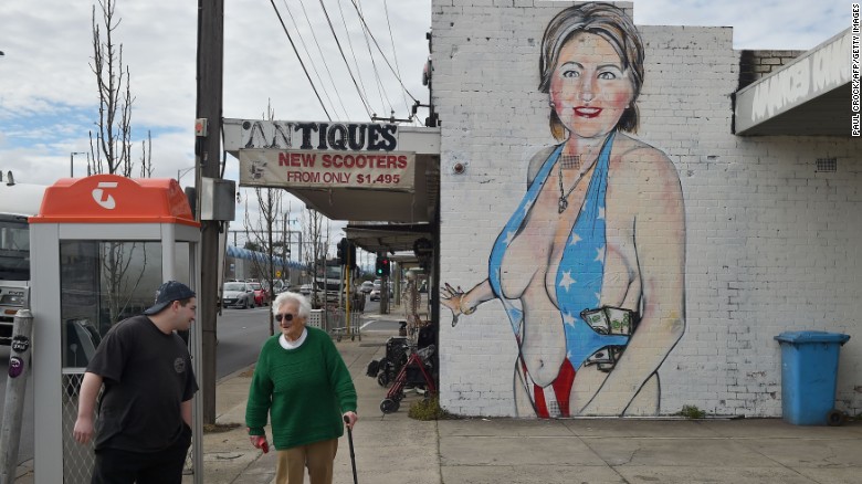 Melbourne graffiti artist sprays burqa over provocative Hillary Clinton mural