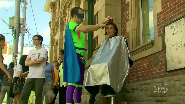 Man dresses like a superhero to give free haircuts on the street