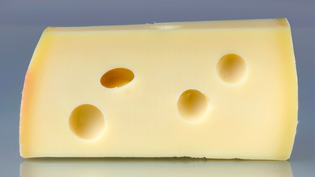 Mystery of holes in Swiss cheese finally solved