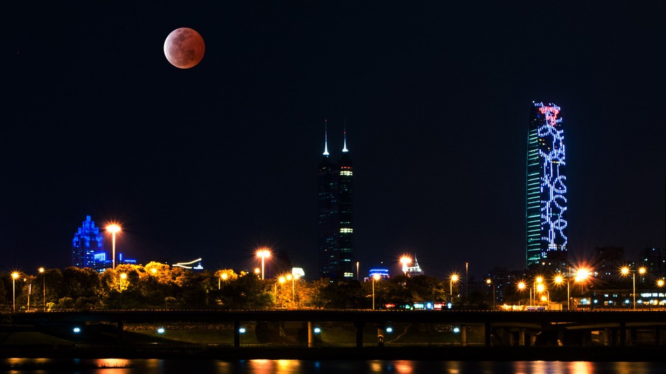 A rare supermoon total lunar eclipse will rise Sunday