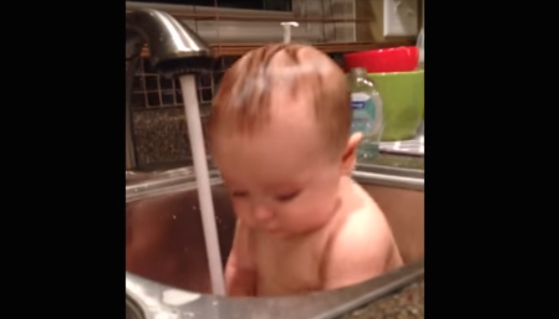 Baby is consistently surprised by running water