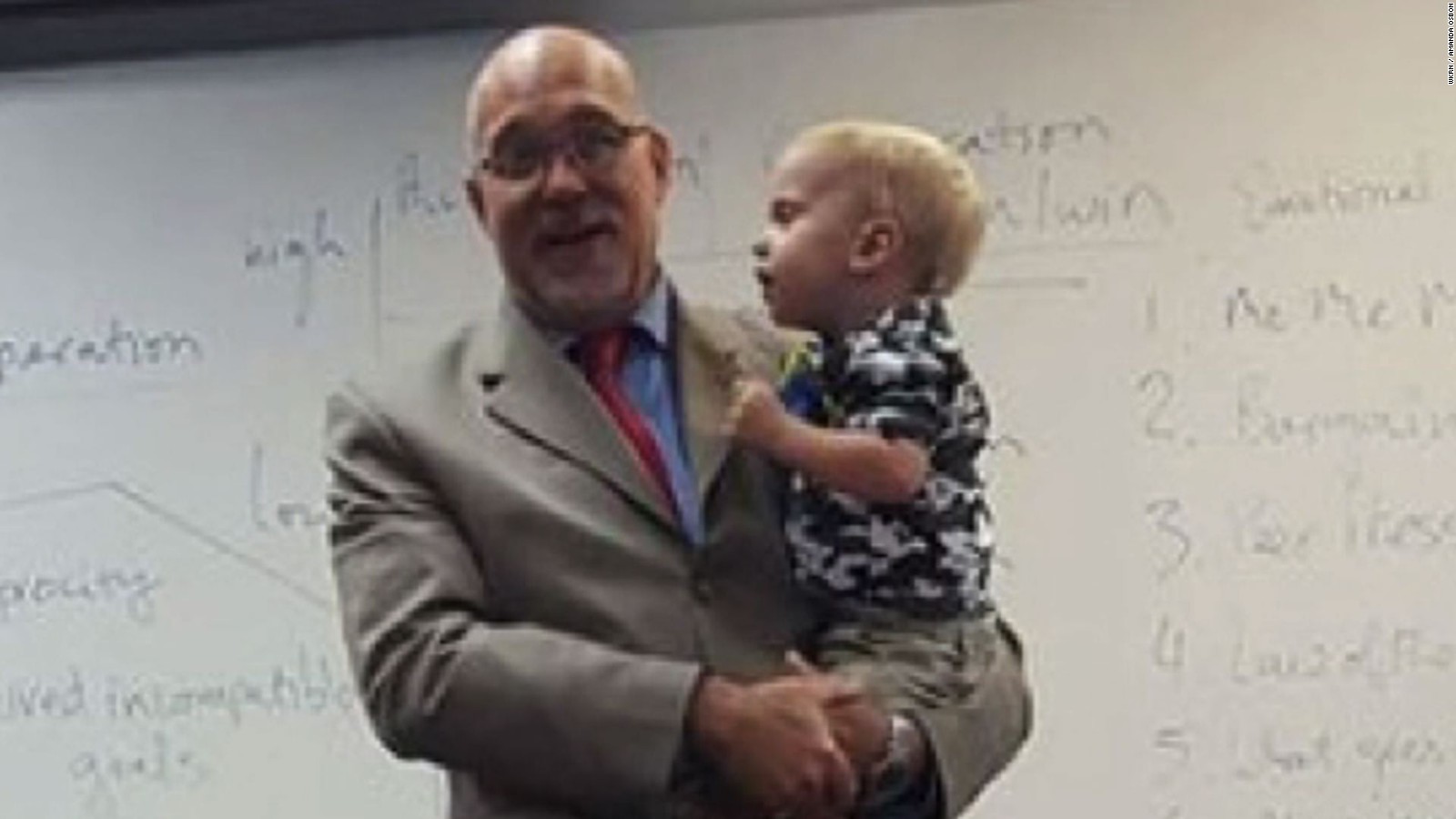 Professor holds single mom's son during class, brings her to tears