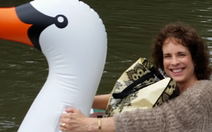 Dedicated midwife rides inflatable swan to work during Houston floods