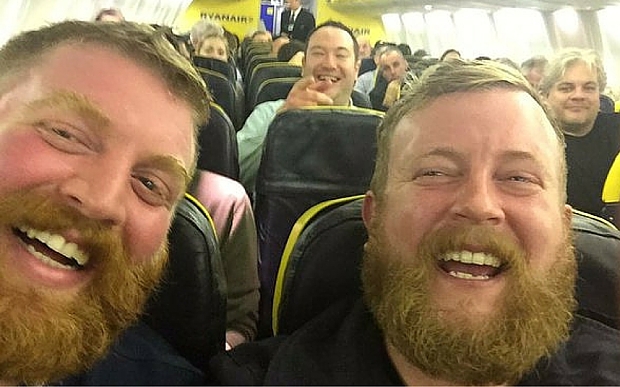 Passenger seated on plane next to stranger who looks exactly like him